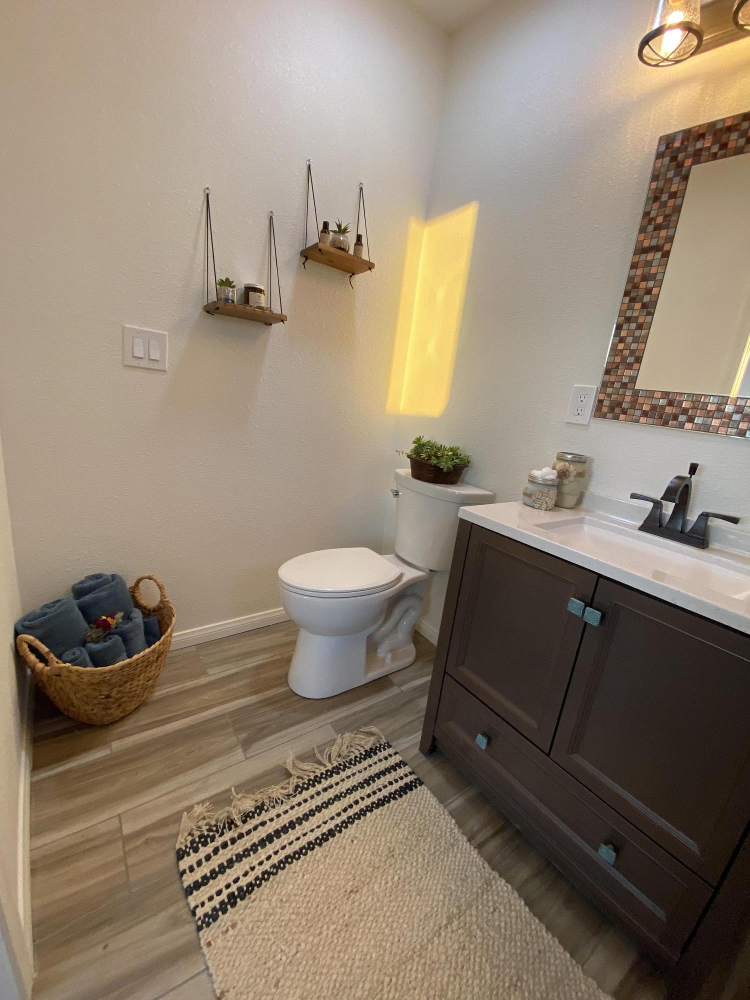 54836 Alderman Road Landers, CA 92285 - Photo 9 of 32 a bathroom with a sink toilet and mirror