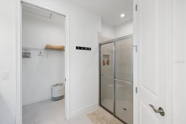 a bathroom with a granite countertop shower