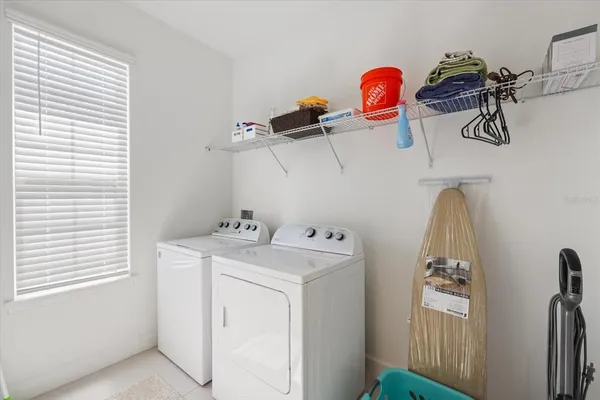a view of a storage & utility room with a window