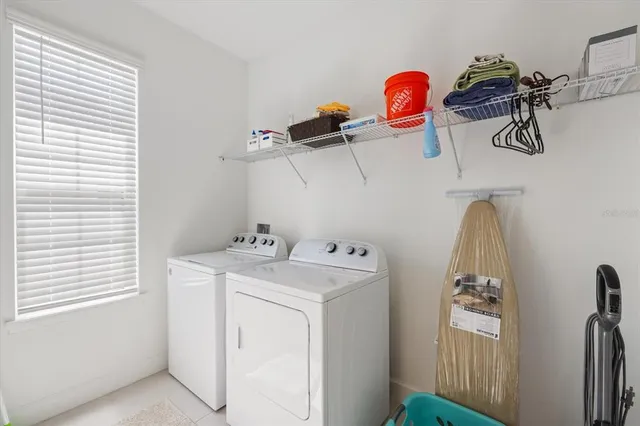 a view of a storage & utility room with a window