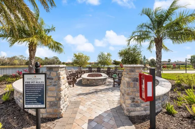 a roof deck with a yard and ocean view