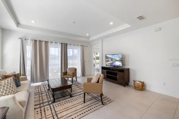 a living room with furniture and a windows