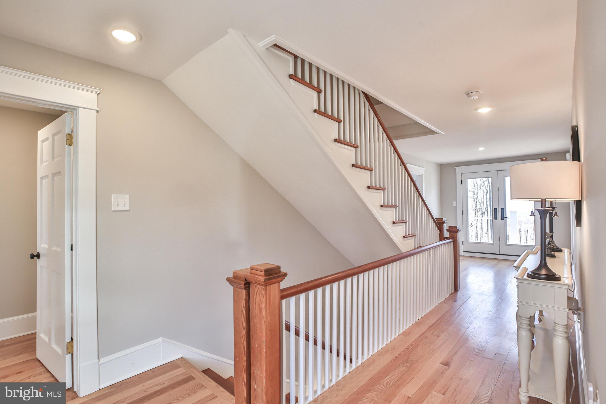 17345 Raven Rocks Road Bluemont, VA 20135 - Photo 52 of 99 a view of a hallway with wooden floor and entryway