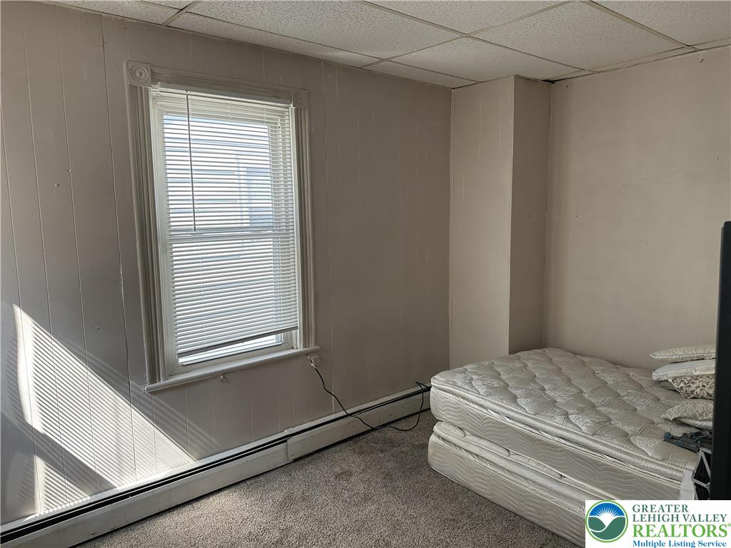 214 South Walnut Street Slatington, PA 18080 - Photo 11 of 19 a bedroom with a bed and a window