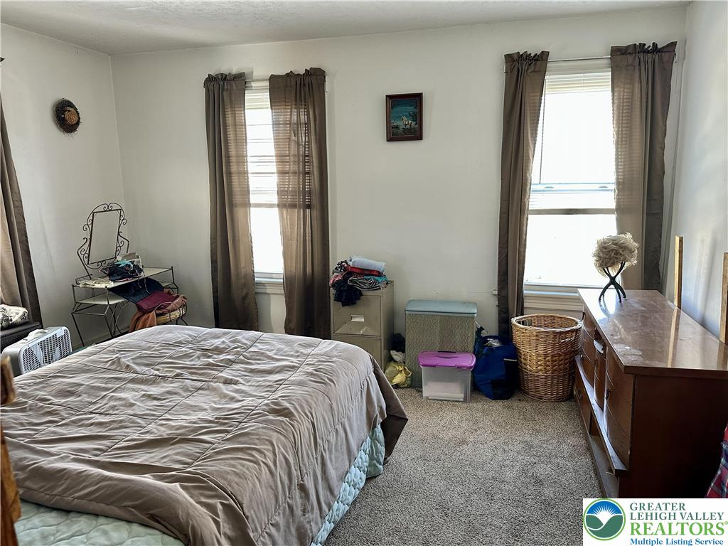 214 South Walnut Street Slatington, PA 18080 - Photo 12 of 19 a bedroom with a bed and a window