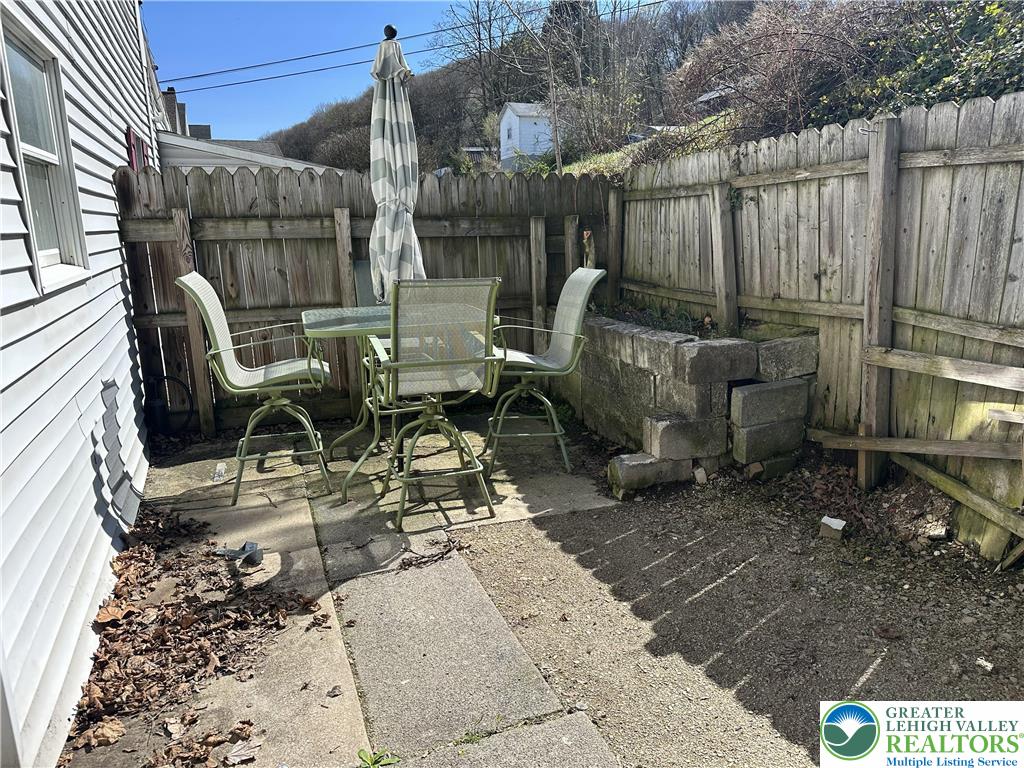 214 South Walnut Street Slatington, PA 18080 - Photo 14 of 19 a view of a backyard with chairs and a fire pit