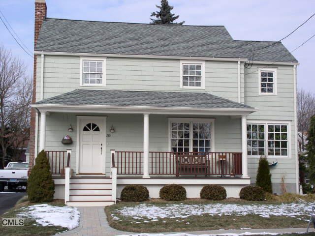 210 Oldfield Road Fairfield, CT 06824 - Photo 1 of 1 a front view of a house with balcony