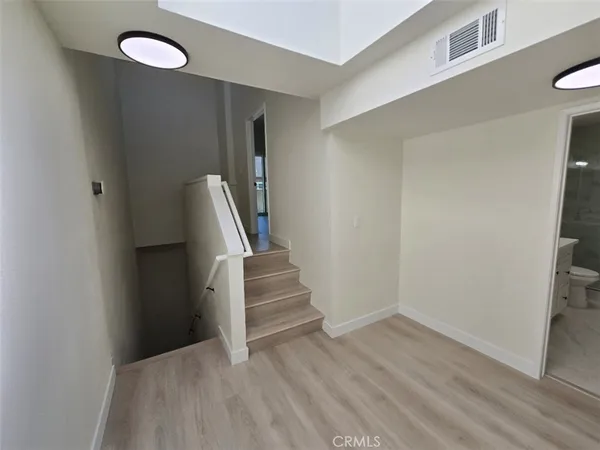 a view of entryway with wooden floor