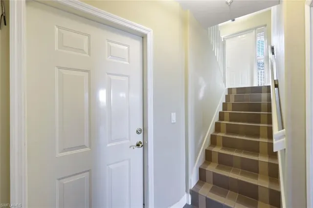 a view of front door with wooden door