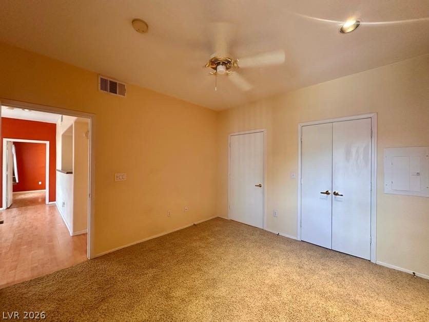 7255 West Sunset Road, Unit 1027 Las Vegas, NV 89113 - Photo 19 of 25 A comfortable bedroom features plush carpeting and a convenient ceiling fan.