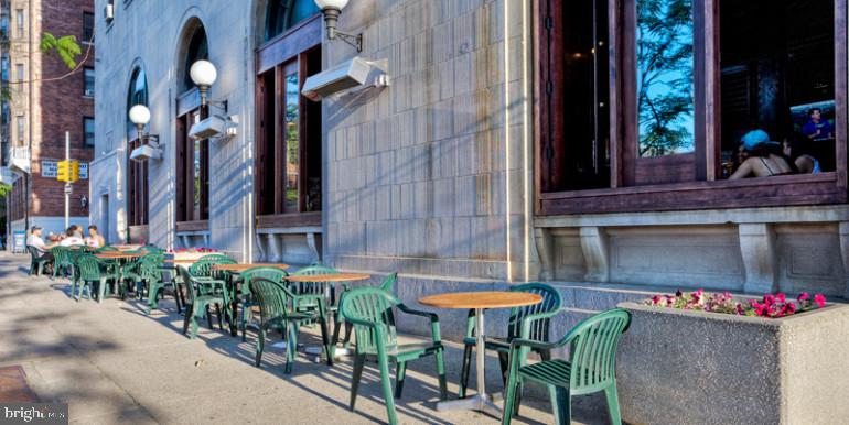 3900 Chestnut Street, Unit 920 Philadelphia, PA 19104 - Photo 7 of 13 a view of a table and chairs in back of the building