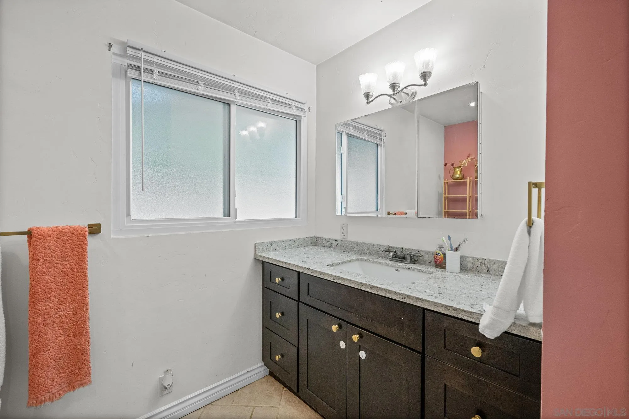 7960 Normal Avenue La Mesa, CA 91941 - Photo 15 of 42 a bathroom with a sink vanity and mirror