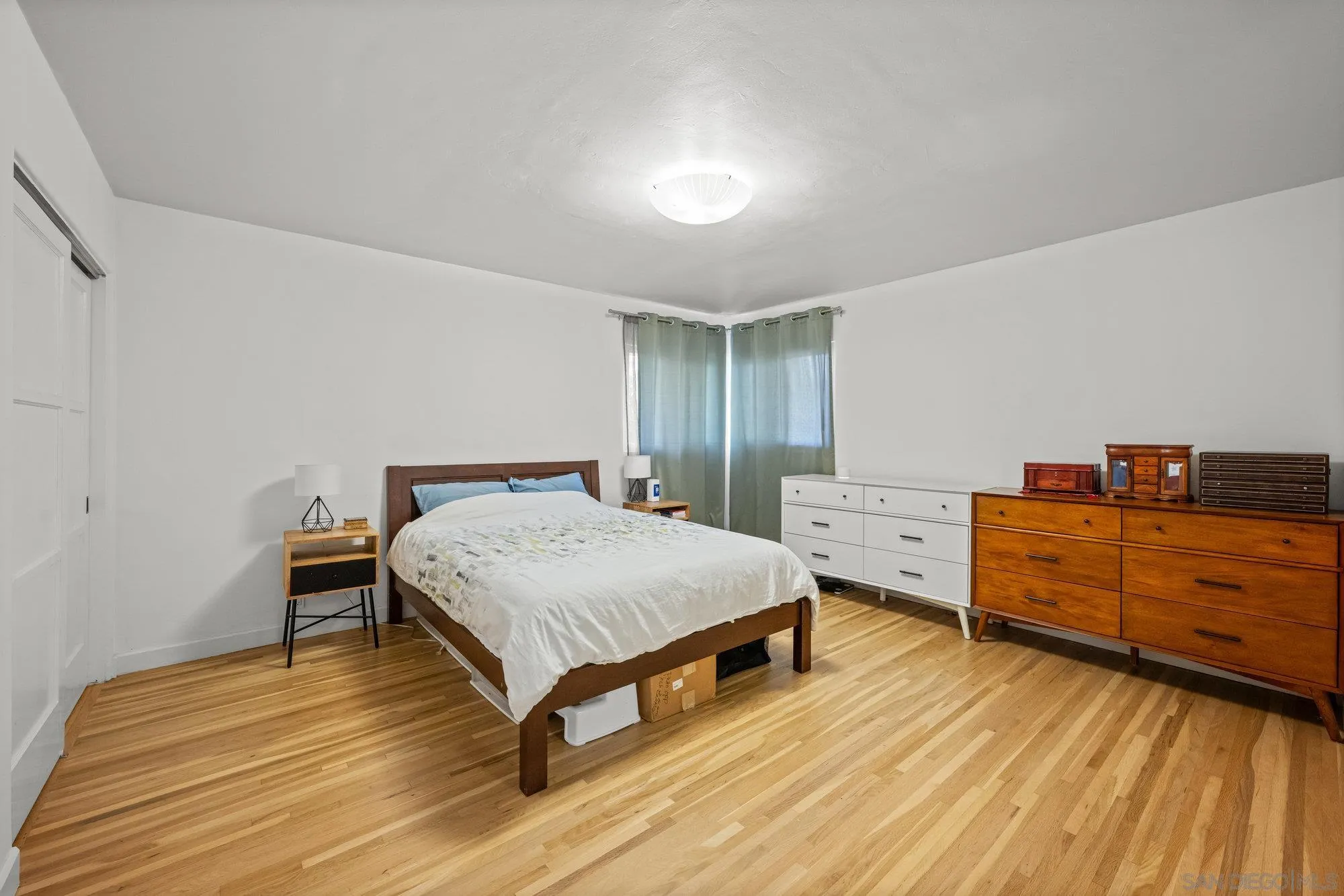 7960 Normal Avenue La Mesa, CA 91941 - Photo 16 of 42 a bed room with a bed and two windows
