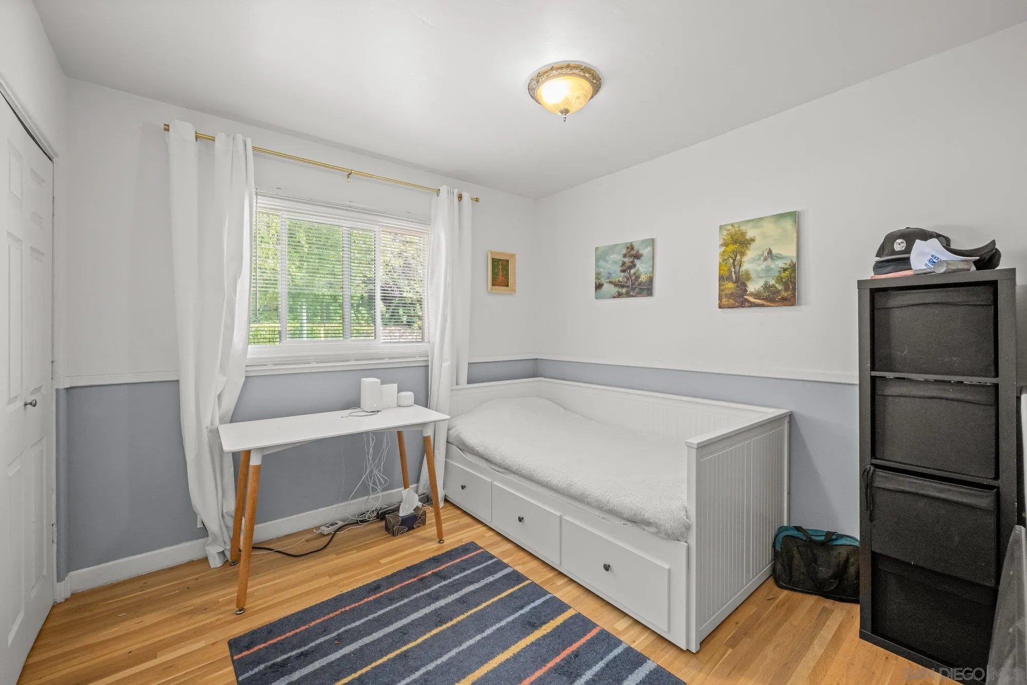 7960 Normal Avenue La Mesa, CA 91941 - Photo 19 of 42 a bedroom with a bed and a table in it