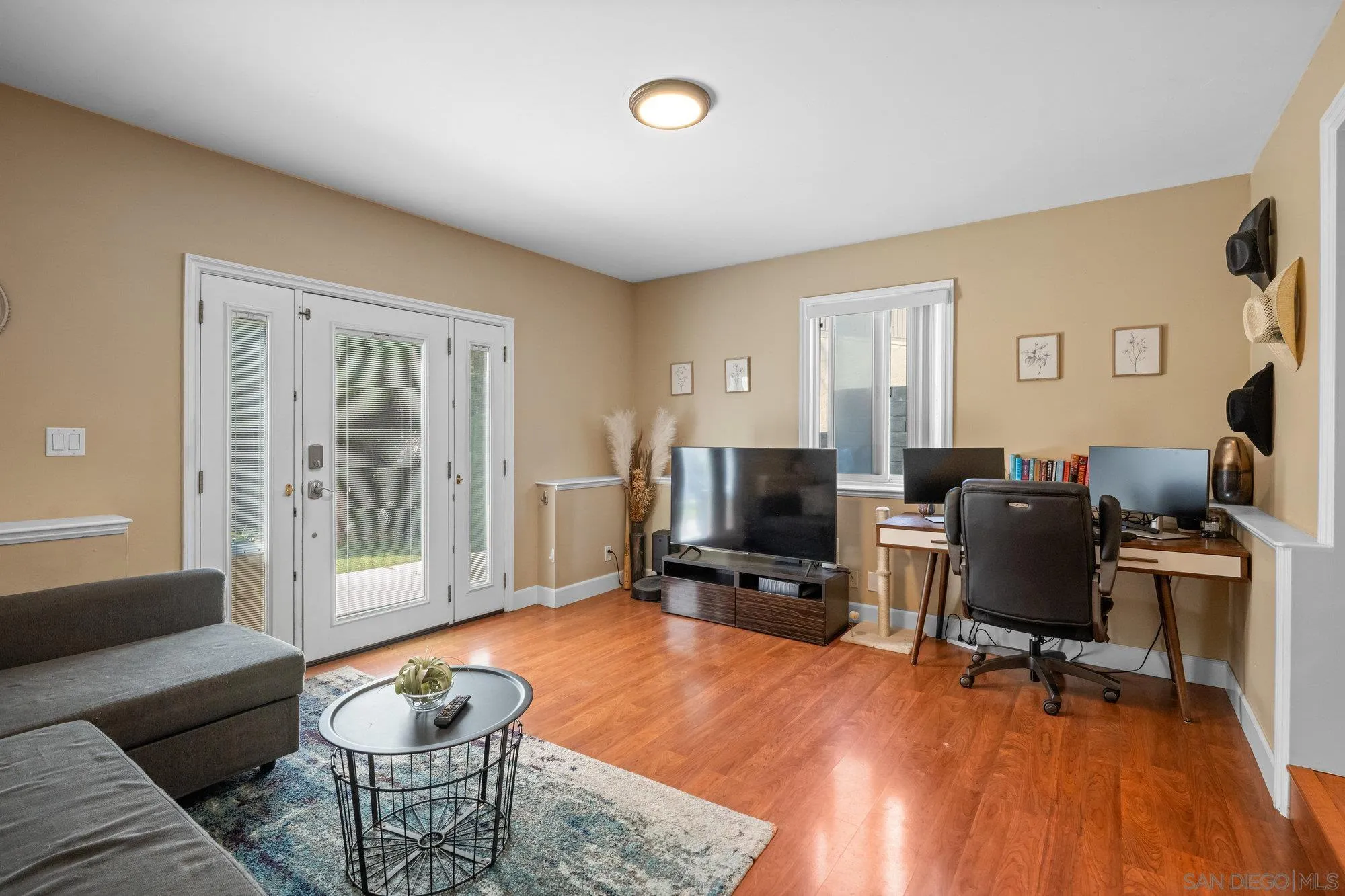 7960 Normal Avenue La Mesa, CA 91941 - Photo 28 of 42 a living room with furniture and a flat screen tv