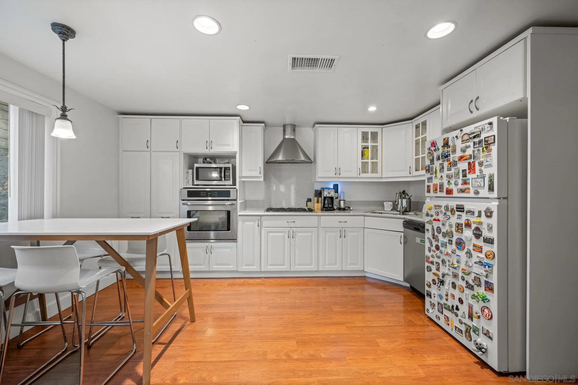 7960 Normal Avenue La Mesa, CA 91941 - Photo 30 of 42 a kitchen with stainless steel appliances granite countertop a refrigerator and a stove top oven
