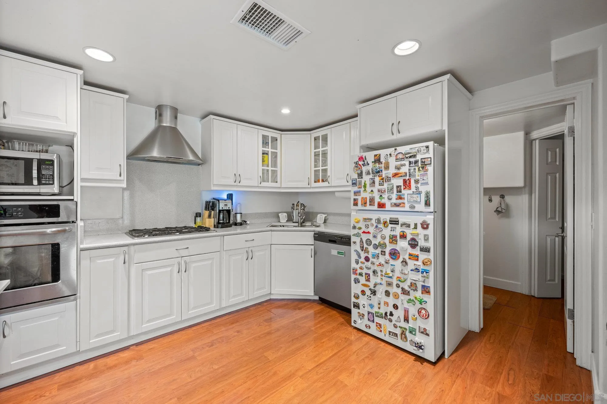 7960 Normal Avenue La Mesa, CA 91941 - Photo 31 of 42 a kitchen with stainless steel appliances a refrigerator and a sink