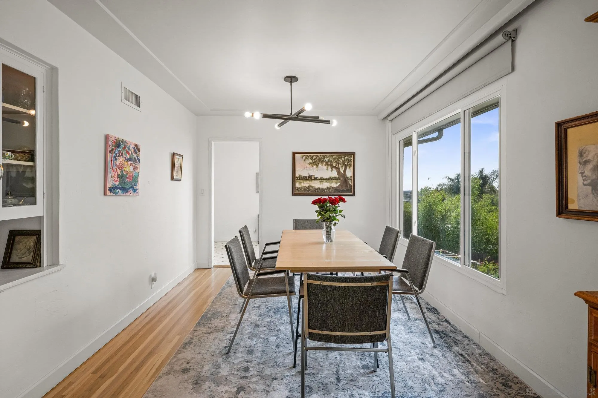 7960 Normal Avenue La Mesa, CA 91941 - Photo 8 of 42 a view of a dining room with furniture window and wooden floor