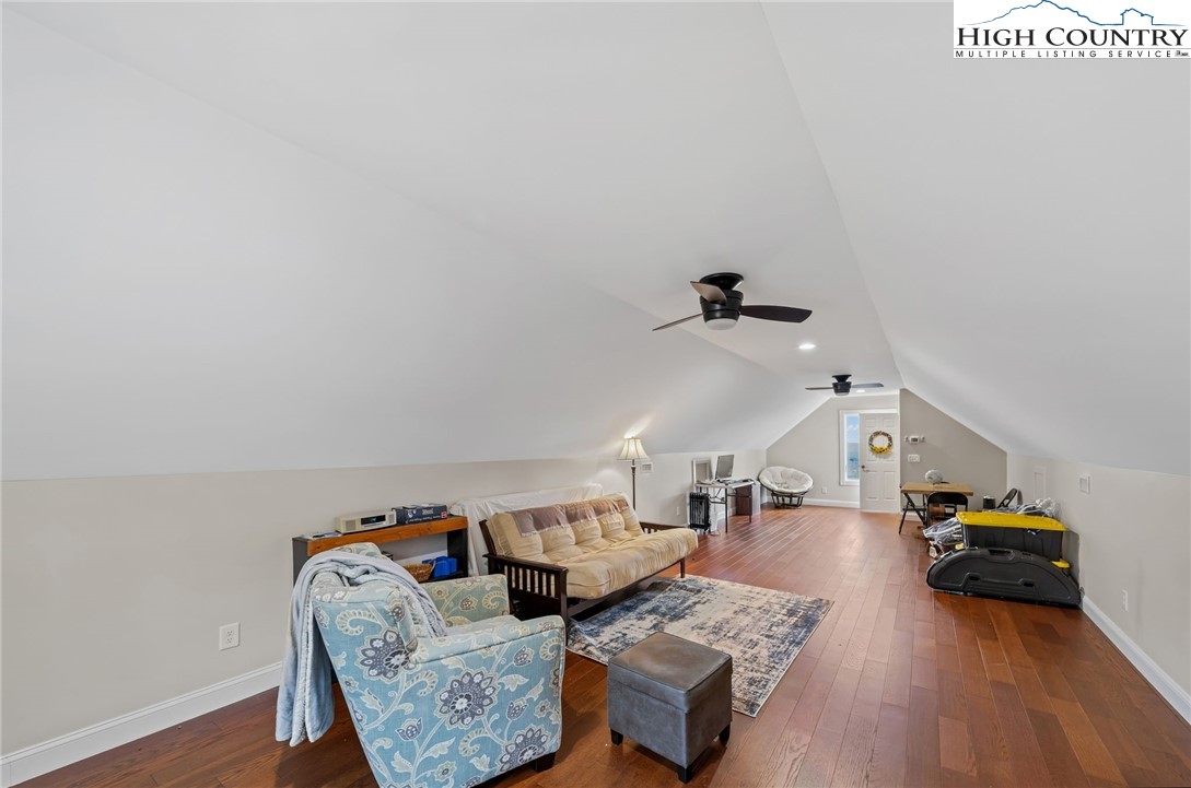 196 Eagle Nest Road Purlear, NC 28665 - Photo 33 of 36 a living room with furniture and wooden floor