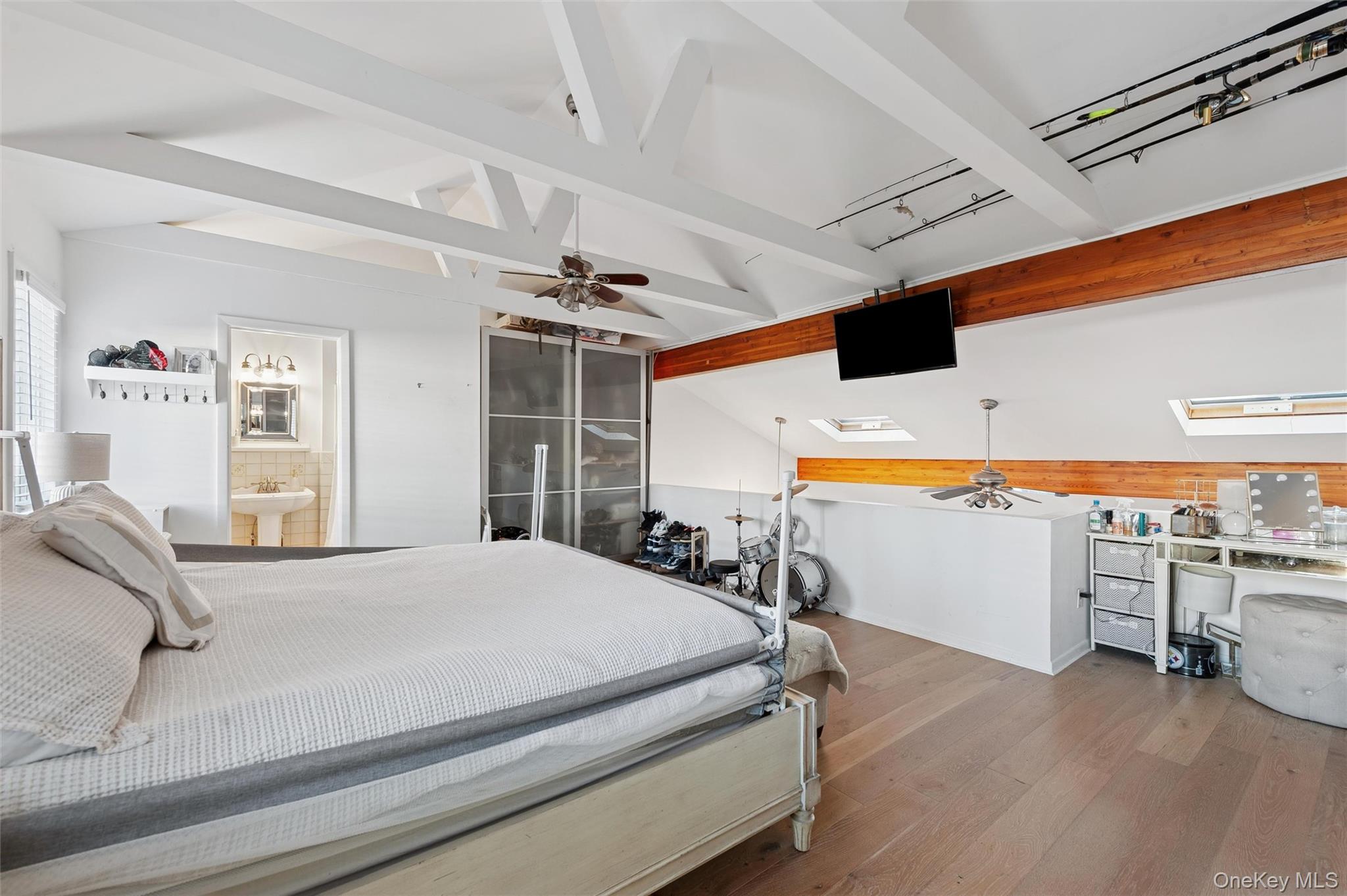 6 Shore Road Southampton, NY 11968 - Photo 15 of 15 Bedroom featuring a skylight and hardwood / wood-style flooring