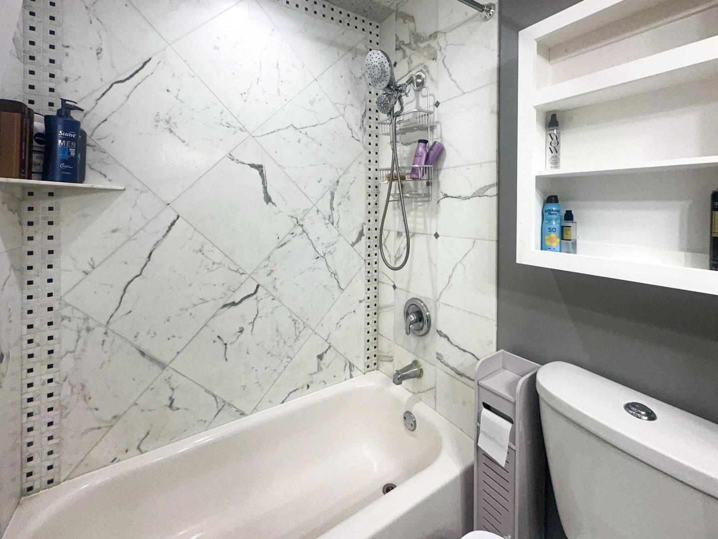 1312 Fall Court, Unit 1312 Wheeling, IL 60090 - Photo 19 of 28 a bathroom with a bathtub and shower