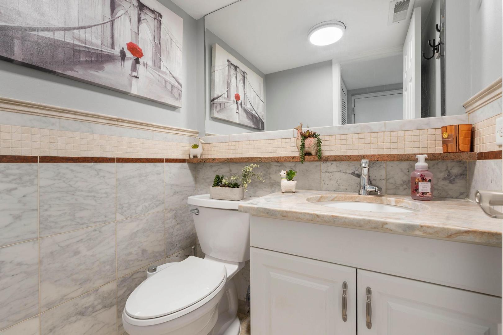 1312 Fall Court, Unit 1312 Wheeling, IL 60090 - Photo 20 of 28 a bathroom with a granite countertop toilet sink and mirror