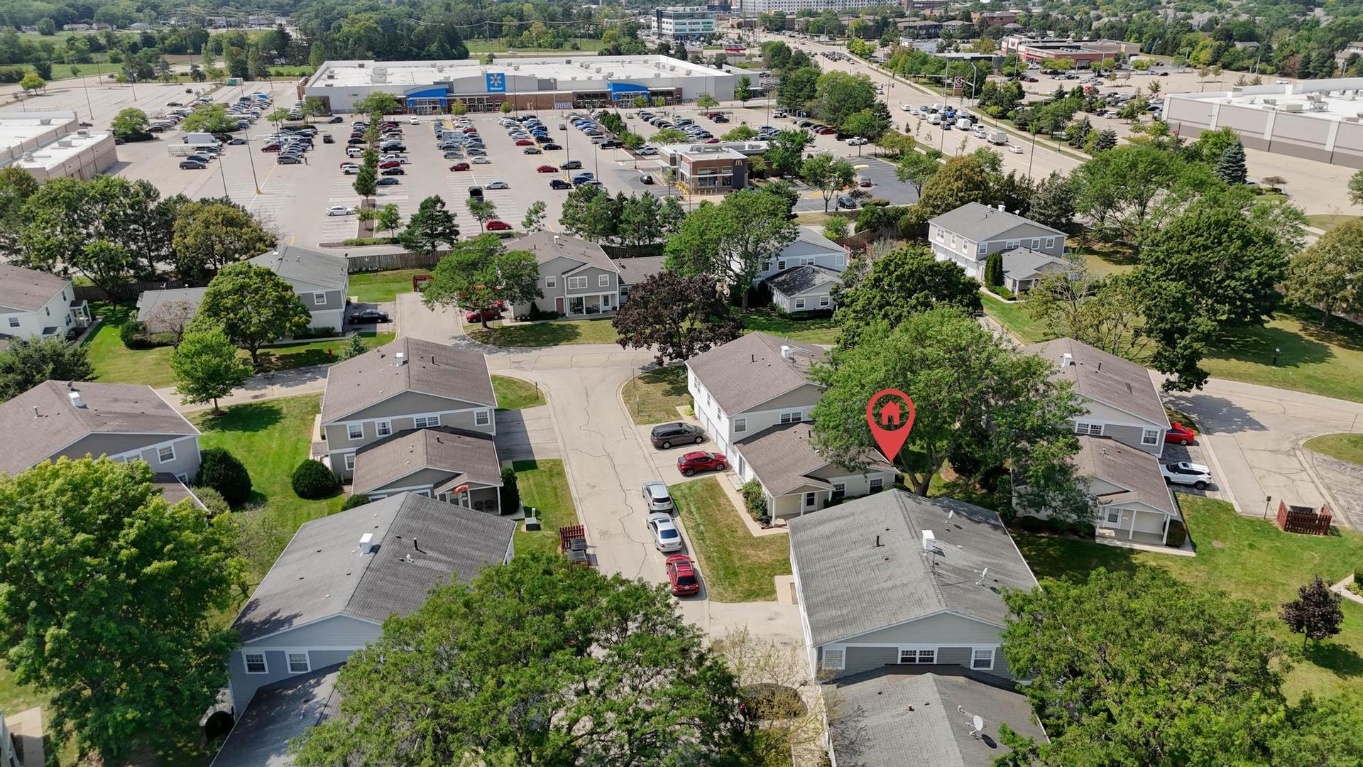 1312 Fall Court, Unit 1312 Wheeling, IL 60090 - Photo 26 of 28 an aerial view of multiple houses with yard