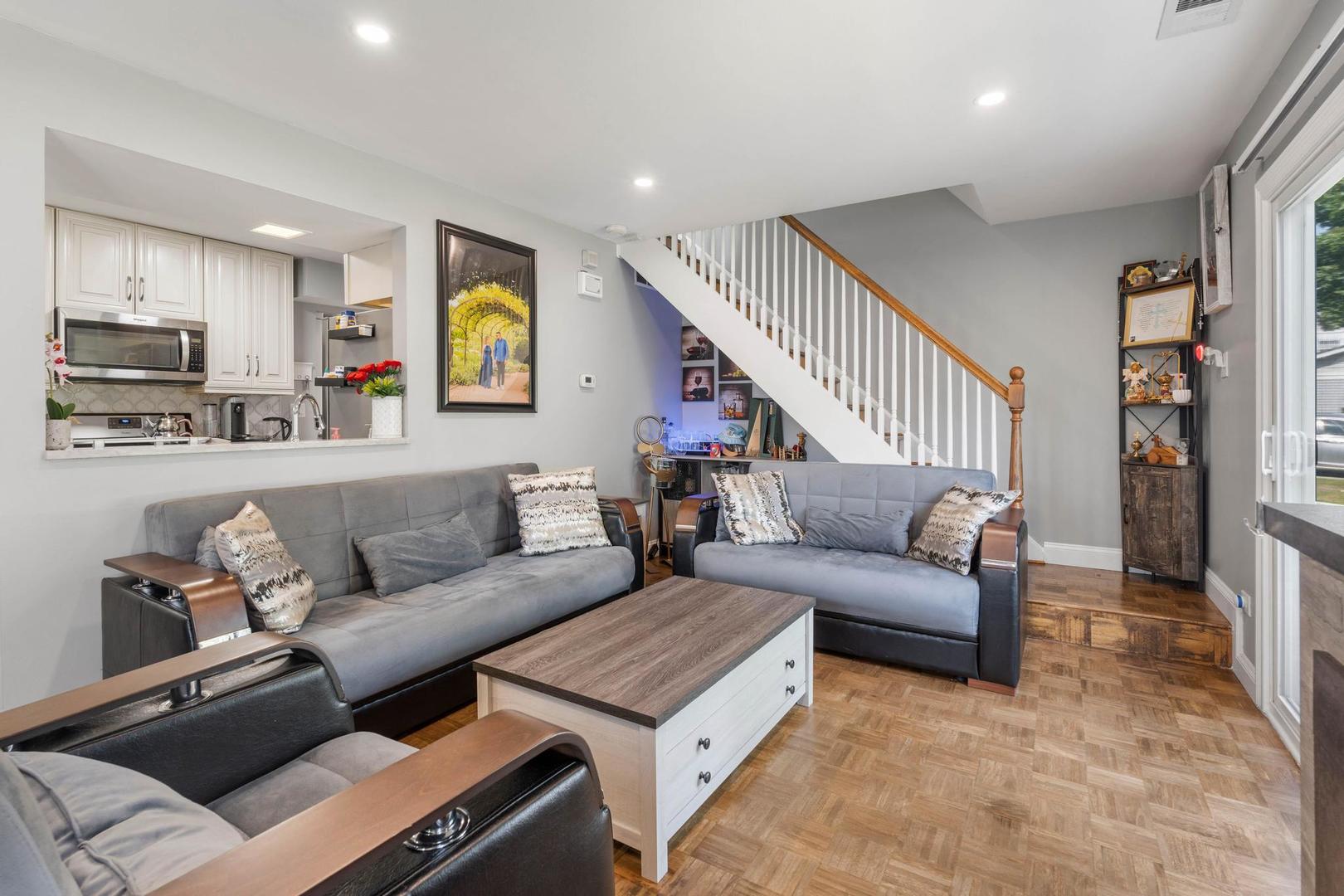 1312 Fall Court, Unit 1312 Wheeling, IL 60090 - Photo 3 of 28 a living room with furniture and a wooden floor
