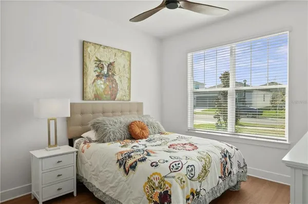 a bedroom with a bed and a window