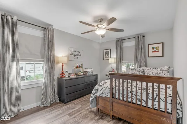 a view of a street with a tree