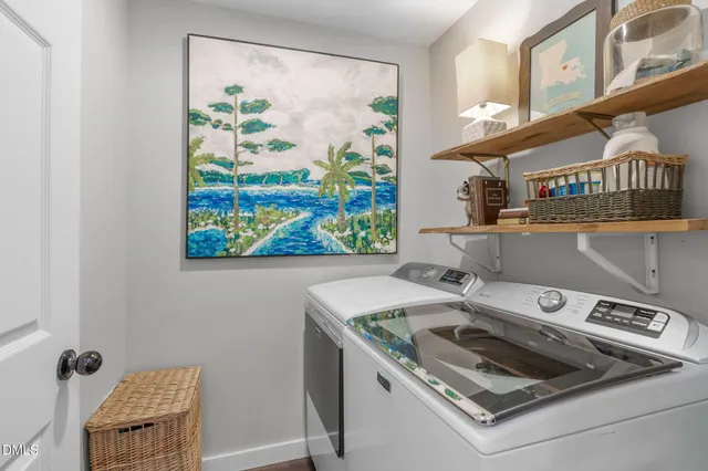 a view of a house with a large tree and a tree