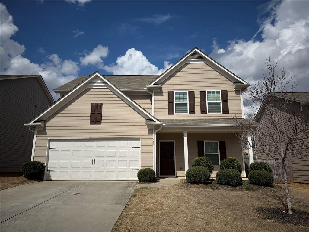 906 Independence Avenue Pendergrass, GA 30567 - Photo 1 of 14 a front view of a house with garden