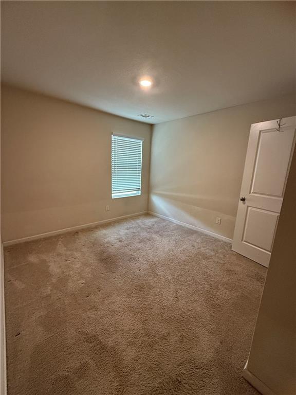906 Independence Avenue Pendergrass, GA 30567 - Photo 12 of 14 an empty room with windows