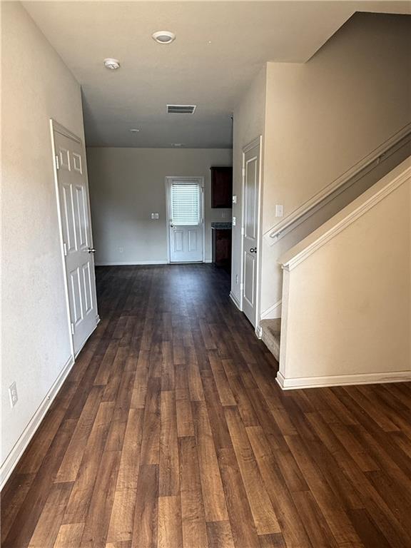 906 Independence Avenue Pendergrass, GA 30567 - Photo 2 of 14 a view of a room with wooden floor and stairs