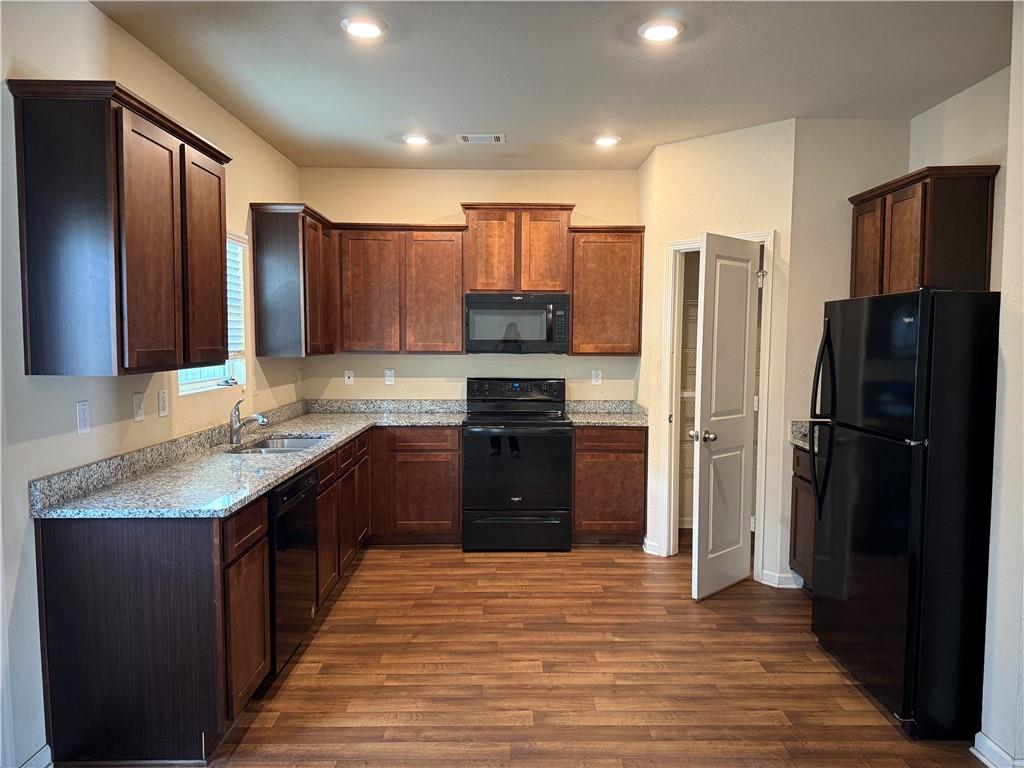 906 Independence Avenue Pendergrass, GA 30567 - Photo 4 of 14 a kitchen with a refrigerator and a sink