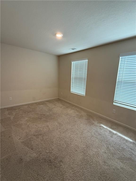 906 Independence Avenue Pendergrass, GA 30567 - Photo 5 of 14 an empty room with a window