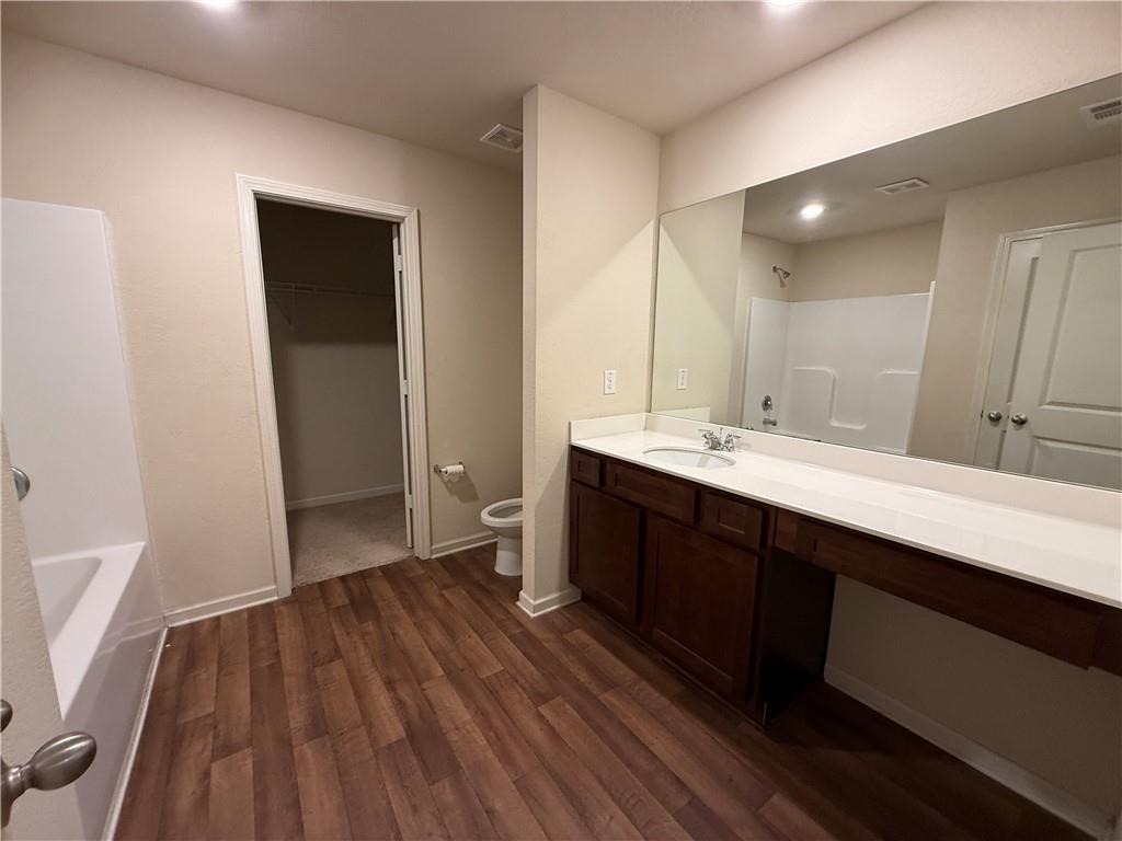 906 Independence Avenue Pendergrass, GA 30567 - Photo 7 of 14 a bathroom with a sink and a mirror