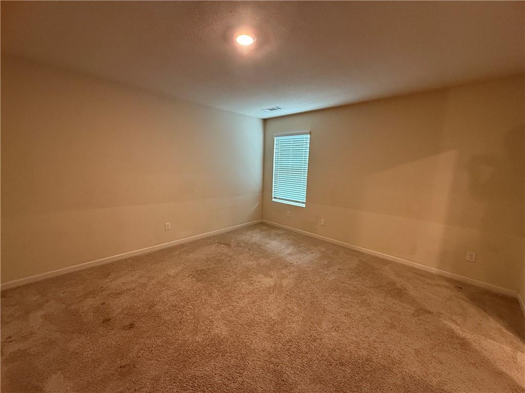 906 Independence Avenue Pendergrass, GA 30567 - Photo 8 of 14 a view of an empty room and window