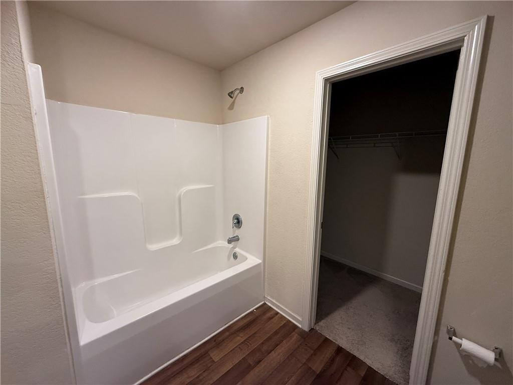 906 Independence Avenue Pendergrass, GA 30567 - Photo 9 of 14 a bathroom with a bathtub