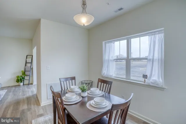 a view of a dining room with furniture window and outside view