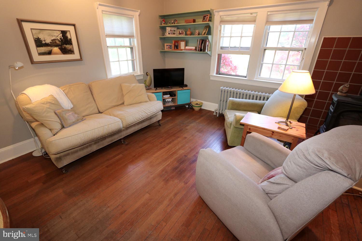 2701 Alden Road Bryn Athyn, PA 19006 - Photo 34 of 105 a living room with furniture a flat screen tv and a window