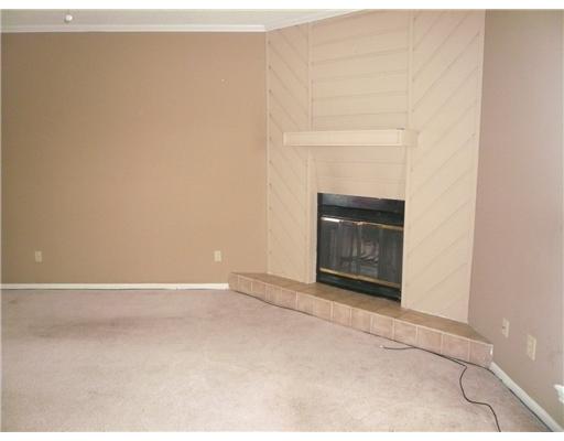 3051 Quail Springs Road, Unit B5 Corpus Christi, TX 78414 - Photo 2 of 7 a view of an empty room with a fireplace