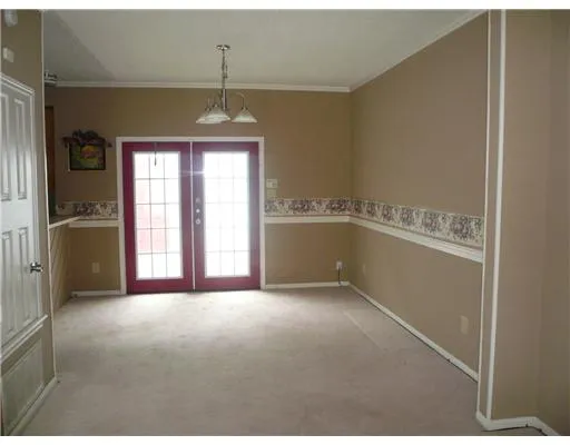 a view of entryway with kitchen