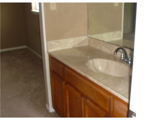 3051 Quail Springs Road, Unit B5 Corpus Christi, TX 78414 - Photo 5 of 7 a bathroom with a sink and a mirror