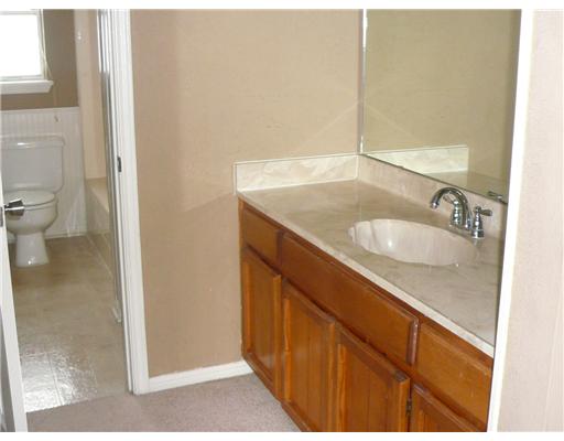 3051 Quail Springs Road, Unit B5 Corpus Christi, TX 78414 - Photo 7 of 7 a bathroom with a sink and a toilet