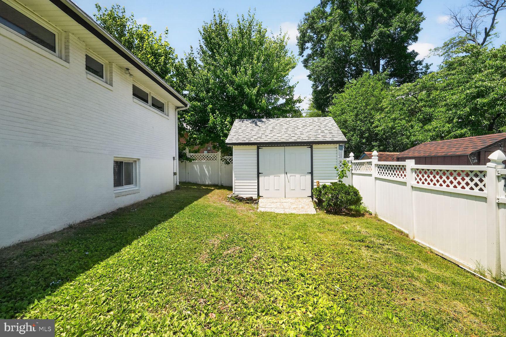 4202 Yates Road Beltsville, MD 20705 - Photo 29 of 31 Charming backyard with storage shed.