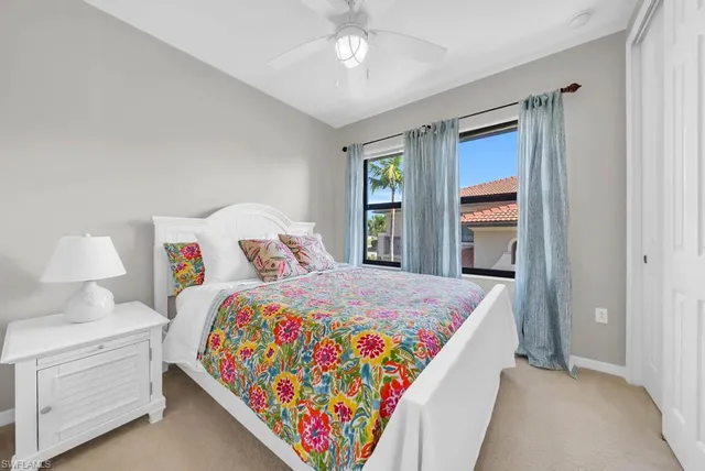 a bed room with a bed and a window