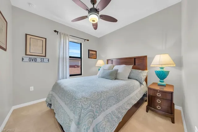 a bedroom with a bed dresser and a window