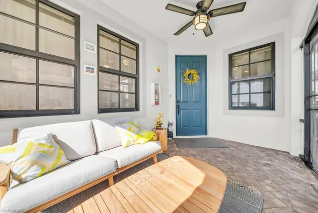 a living room with furniture and window