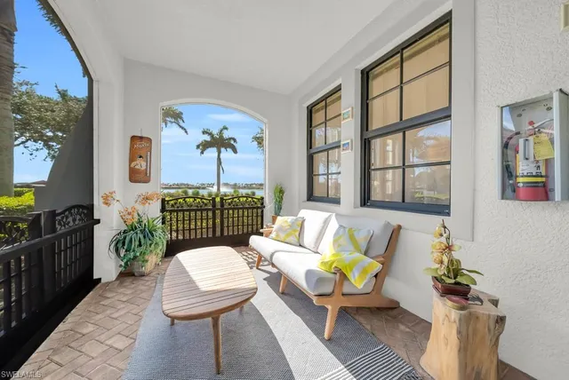a living room with furniture and a gate